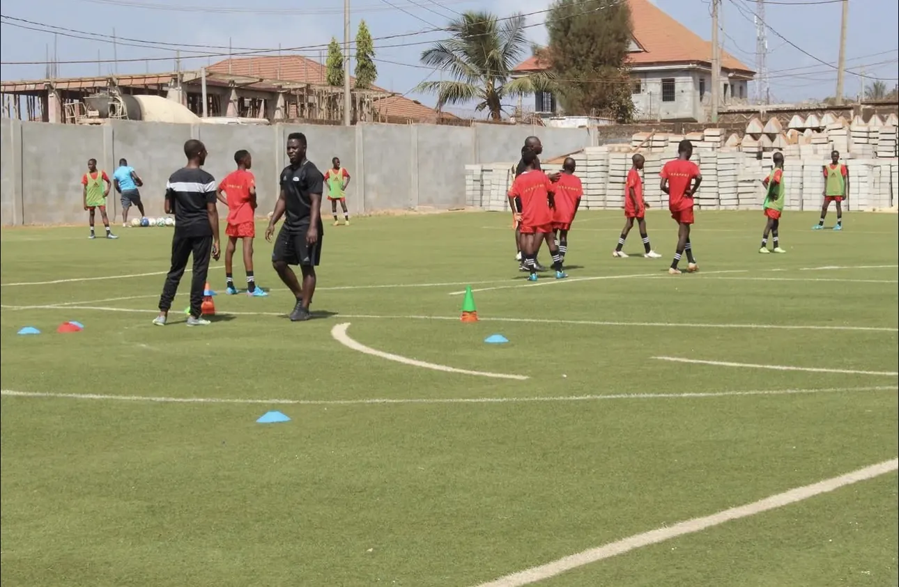 Coaches talking with players during a training session